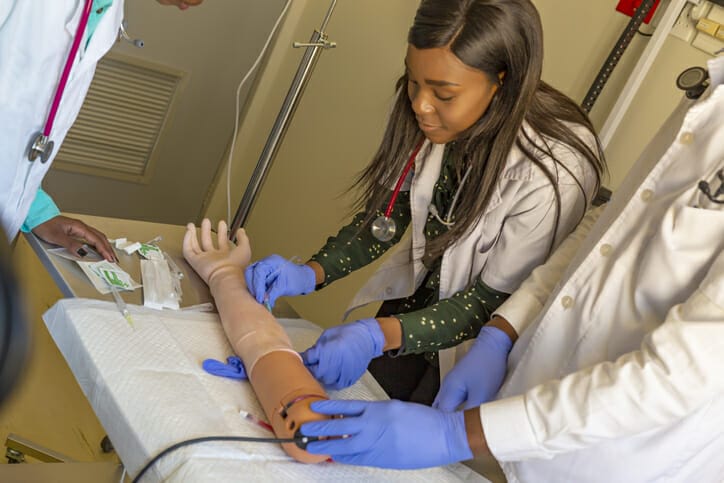 A student participates in a free CNA training program