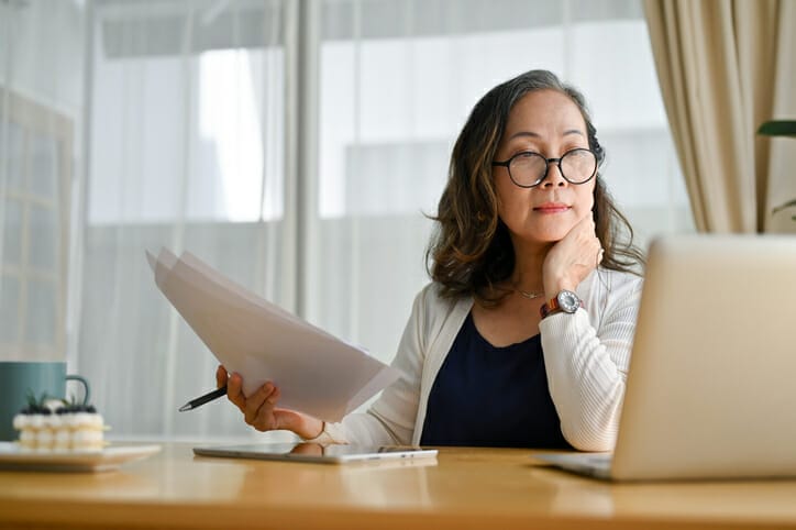 Woman reviews something on a computer